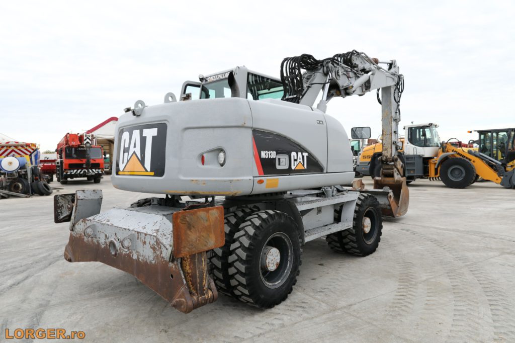 Excavator pe pneuri Caterpillar M313D - 2009
