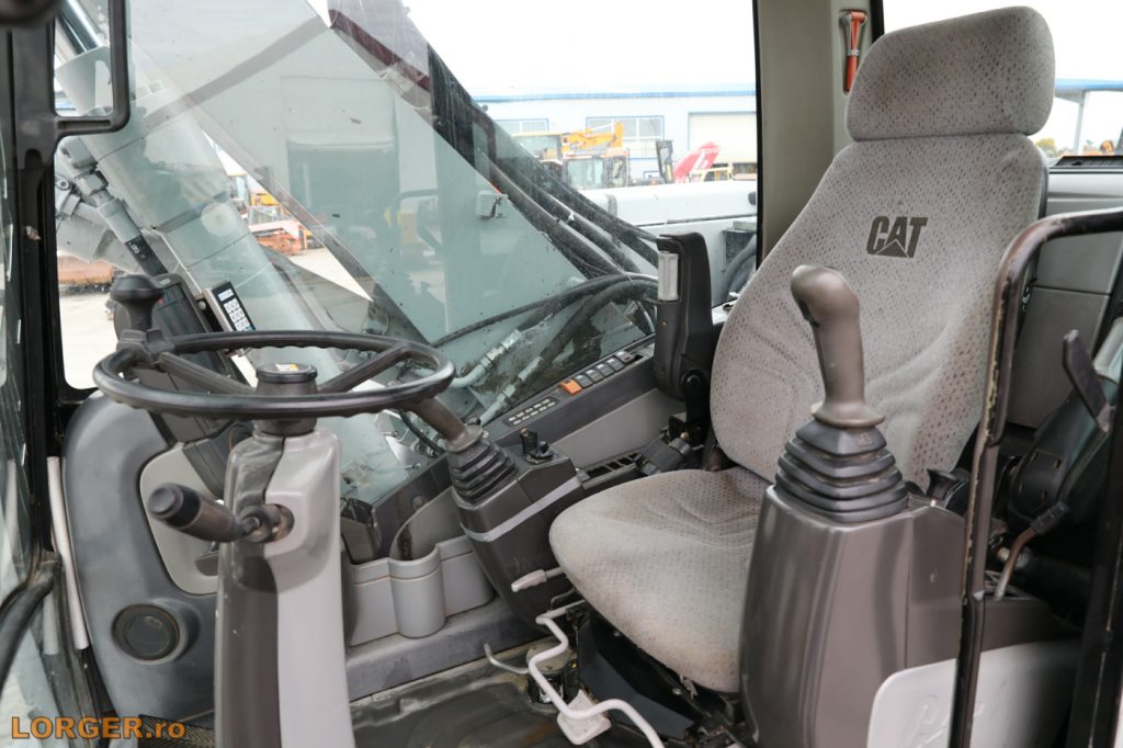 Excavator pe pneuri Caterpillar M313D - 2009
