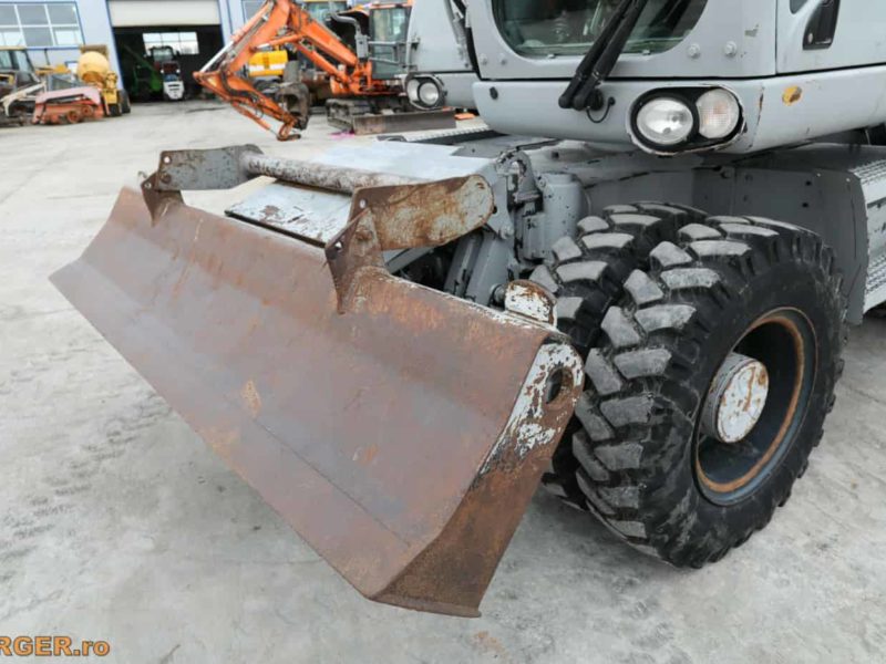 Excavator pe pneuri Caterpillar M313D - 2009